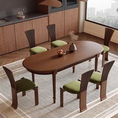 a dining room table with green chairs around it