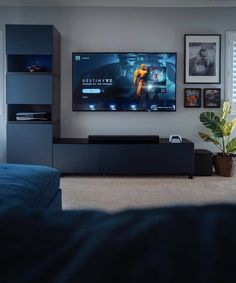 a flat screen tv mounted on the wall in a living room