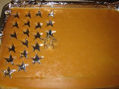 an orange cake with silver stars on it and frosting in the shape of a flag