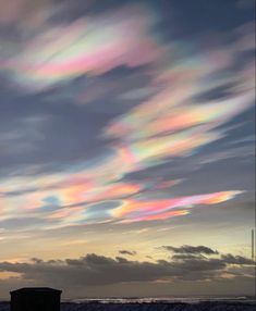 the sky is filled with many colorful clouds