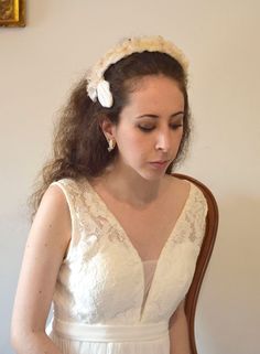 Enhance your bridal look with this exquisite Romantic Organza Bridal Headpiece. Handmade with utmost precision, this headpiece features delicate silk blooms beautifully arranged on an organza crown. The light pink and white color combination adds a charming touch, perfect for a romantic and dreamy wedding. The silk flowers exude elegance and femininity, while the organza crown adds a touch of ethereal beauty. This headpiece is designed to bring out the radiance of any bride, elevating her style and complementing her wedding gown flawlessly. Bestow a touch of romance and grace to your special day with this stunning and unique bridal headpiece. It is a comfortable headband that is held by three small combs and also has some loops to attach with hairpins. You can wear it with or without a vei Organza Bridal, White Fascinator, Bridal Floral Headpiece, Wedding Hair Wreath, Comfortable Headbands, Hair Wreaths, Pink Bridal, Floral Headpiece, Bridal Crown