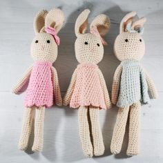 three crocheted stuffed animals sitting next to each other