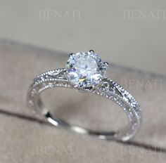 a diamond ring sitting on top of a box