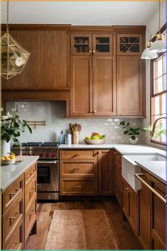 a kitchen filled with lots of wooden cabinets and counter top space next to a window