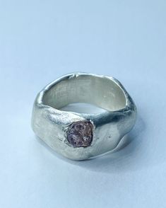 A one of a kind ring for the individuals among us. Handmade with recycled sterling silver and a stunning raw pink sapphire using the unpredictable process of sand casting with stones in place. As the molten metal pours into the clay it fixes the stones (only sapphires, diamonds, rubies and garnets are hard enough to survive this process) and 'sets' them in place. It's a chance driven method and much can go wrong; making this ring even more precious. I do not repeat my waxes, meaning this is the Silver Clay Rings, Silver Clay Ring, Raw Sapphire Ring, Cast Rings, Molten Metal, Raw Diamond Engagement Rings, Sand Casting, Raw Diamond, Ring Unique