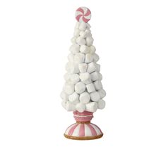 a pink and white christmas tree made out of marshmallows on a stand