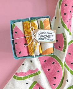 a watermelon themed dish towel in a box