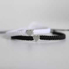 Black and White matching bracelets These lovely bracelets are made with waterproof cord. Designed for couples Both bracelets are adjustable and waterproof. Includes Gift Box. White Nylon Cord Friendship Bracelets As Gift, Aesthetic Couple Bracelet, White Nylon Cord Braided Friendship Bracelet, Couple Bracelets Aesthetic, Adjustable Black Heart Bracelet For Friendship, Couples Black Bracelets For Best Friend Gift, Adjustable Black Heart Bracelet For Best Friend Gift, Black Bracelet, Black Heart Bracelet For Couples Friendship