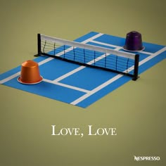 a ping pong racket and an orange cone on a blue tennis court with the words love, love