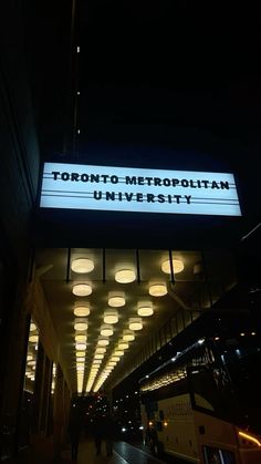 a sign that reads toronto metropolitan university at night