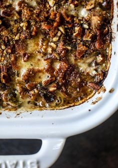 a casserole dish filled with meat and cheese