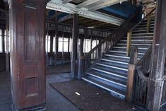 an old run down building with some stairs