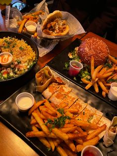 two trays filled with different types of food