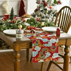 a dining room table set for christmas dinner