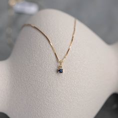 Blue Sapphire pendant in 14K solid yellow gold in prong set. A minimal necklace for women, ideal for a birthday gift, as sapphire is the September birthstone. It is sold as necklace or just pendant without chain. D E T A I L S ● Metal: 14K solid gold, 14K white gold ● Gemstones: Sapphire, round cut 3mm ● Gemstones Weight: Sapphire 0.10 ct ● Length: 40 cm - 16 inches H O W ∙ T O ∙ O R D E R Choose from the drop-down menu the available options (Metal) and leave us a note for any special requirements. G I F T S All our pieces are delivered beautifully packaged and gift ready with a certificate of authenticity for the metal and the stones. P R O D U C T I O N ∙ T I M E * S H I P P I N G * P O L I C I E S Please keep in mind that each item is handcrafted, and we need 5 days at least for its pro Dainty Sapphire Necklace, Gemstone Pendant Design, Sapphire Necklace Simple, Gold Sapphire Necklace, Sapphire Necklace Gold, Birthstone Necklaces, Pendant Designs, Ruby Necklace Pendant, Blue Sapphire Pendant