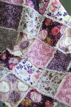 a patchwork quilt is displayed on a table