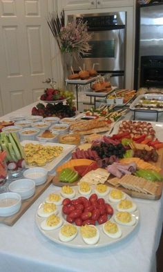 an assortment of food on a table in a kitchen