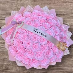 a bouquet of pink roses in a box with a ribbon that says, tax here