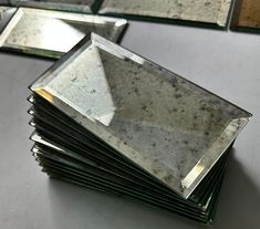 a stack of mirrors sitting on top of a table