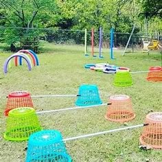 an outdoor play area with colorful plastic cones