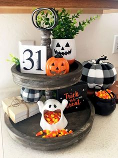 three tiered tray with halloween decorations on it