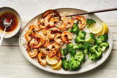 shrimp, broccoli and rice with sauce on a plate