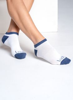 A classic look in classic colors. These high-performance ankle socks with retro pom poms bring some fun nostalgia to the court or course. Sporty Stretch Blue Socks, Sporty Blue Stretch Socks, Blue Stretch Sporty Socks, Sports Cotton Socks, Sporty Non-slip Stretch Socks, Blue Cotton Sporty Socks, Casual Blue No-show Socks, Casual Blue Non-slip Socks, Blue Anti-odor Sporty Socks