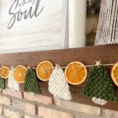 an orange slice garland is hanging on the mantle