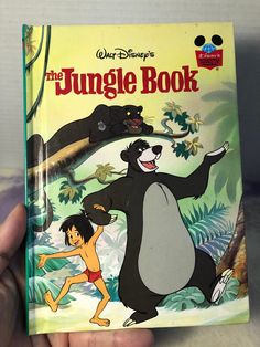 the jungle book with an image of a bear and a monkey on it's back