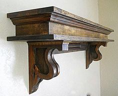 an old wooden shelf with some wood carvings on it's top and bottom edge