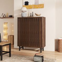 a living room filled with furniture and a painting hanging on the wall above it's radiator