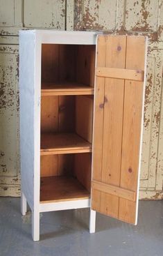 a wooden cabinet with two open doors