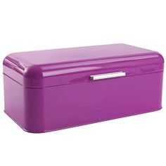 a large purple box is sitting on the floor and it's lid has a silver handle