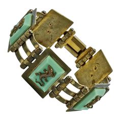 Fabulous Jean Painlevé French Art Deco gold plated link bracelet, with mint green Bakelite, and featuring five salamanders. Measuring length 17.7cm / 6.9 inches by width 2.4cm / .9 inch. The bracelet has wear to the gold plating and scratching. The salamanders are in good condition, one has a twisted tail. This is a beautiful Painlevé salamander bracelet from the Art Deco era. Circa 1930s. A rare find. Measuring Length, Art Deco Gold, Salamanders, Liquid Silver, French Art Deco, Art Deco Era, French Art, Belle Epoque, Link Bracelets