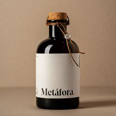 a bottle of wine with a corked top and label on the bottom that says metafora