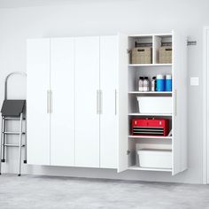 a white storage cabinet with drawers and shelves