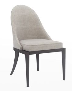 an upholstered chair with a curved back and legs, on a white background