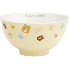 a white bowl with various stickers on it