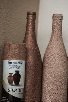 two wine bottles are sitting next to each other