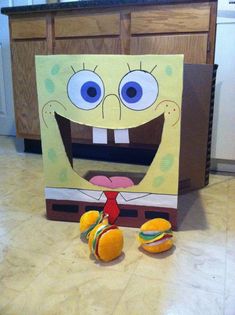 a cardboard box with an image of spongebob and oranges on the floor