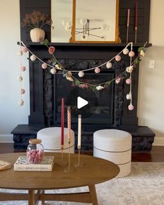 a living room filled with furniture and a fire place in front of a fireplace covered in decorations