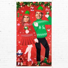 a man and woman in christmas sweaters standing next to each other on a red background