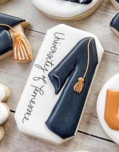 decorated cookies with graduation caps and gowns on them