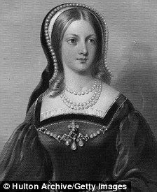 an old black and white photo of a woman in a dress with pearls on her head