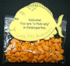 there is a bag of peanuts in the shape of a fish with a sign on it