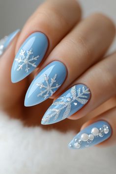 Elegant 2024 Christmas nails featuring festive designs. The first set displays sparkling silver nails with red glitter tree branches, adding a holiday twist. The second showcases icy blue nails with silver snowflakes and pearls, capturing winter's beauty. The final design offers a bold red look with white snowflakes and glitter, perfect for a festive celebration. A mix of glitter, glossy finishes, and intricate decorations makes these nail ideas perfect for your holiday inspiration.  #ChristmasNails #HolidayNailArt #FestiveNails #GlitterNails #NailDesign2024 #WinterNailInspo #SnowflakeNails #RedAndSilverNails #BlueNails #NailTrends2024 #HolidayManicure Simple Winter Nail Ideas, Simple Winter Nails, Red And Silver Nails, Acrylic Ideas, Nail Prices, Holiday Nail Art