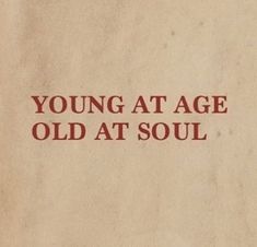 an old book with the words young at age old at soul written in red on it