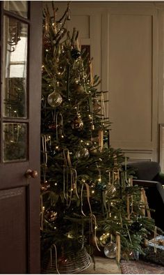 a decorated christmas tree in a living room