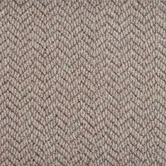 an up close view of the texture of a carpet with small, wavy lines on it