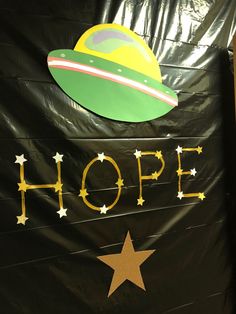 a sign that says hope with stars on it